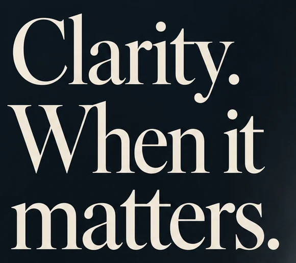 Close-up of the cream serif headline Clarity. When it matters. on a dark slate background.