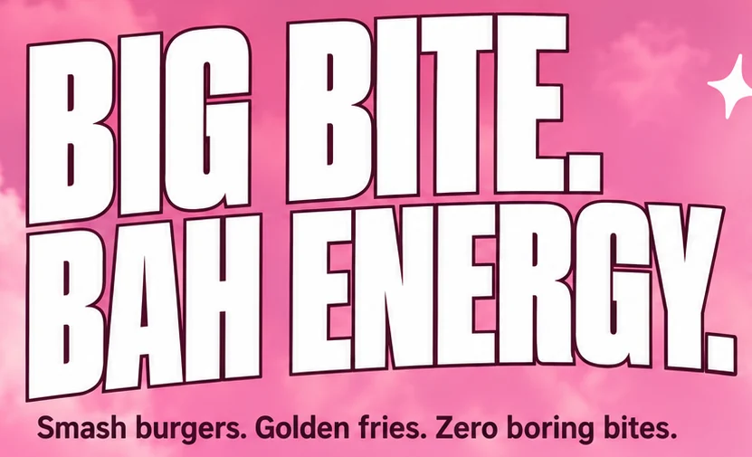 Bah hero headline close-up: BIG BITE. BAH ENERGY. in outlined white capitals on pink cloud, with the strapline below