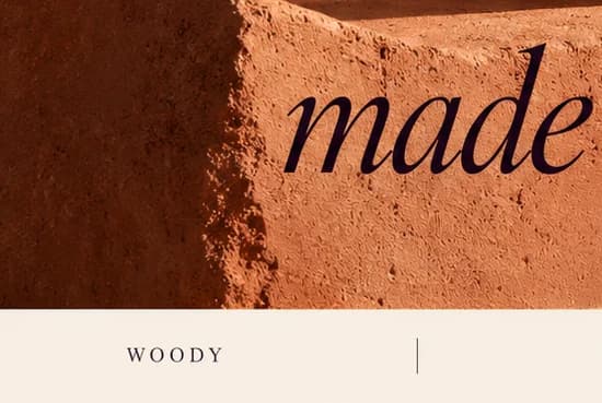 The italic word 'made' in aubergine on a sandstone block, above a cream strip with the label 'WOODY'