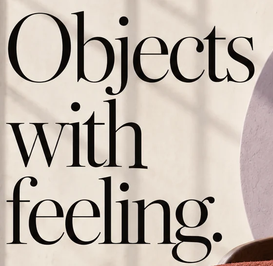 Headline 'Objects with feeling.' in a tall black serif over three lines, on a sunlit plaster wall