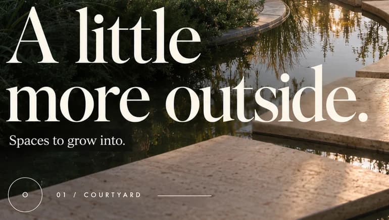 Close-up of the warm white serif headline A little more outside. above Spaces to grow into. and 01 / Courtyard